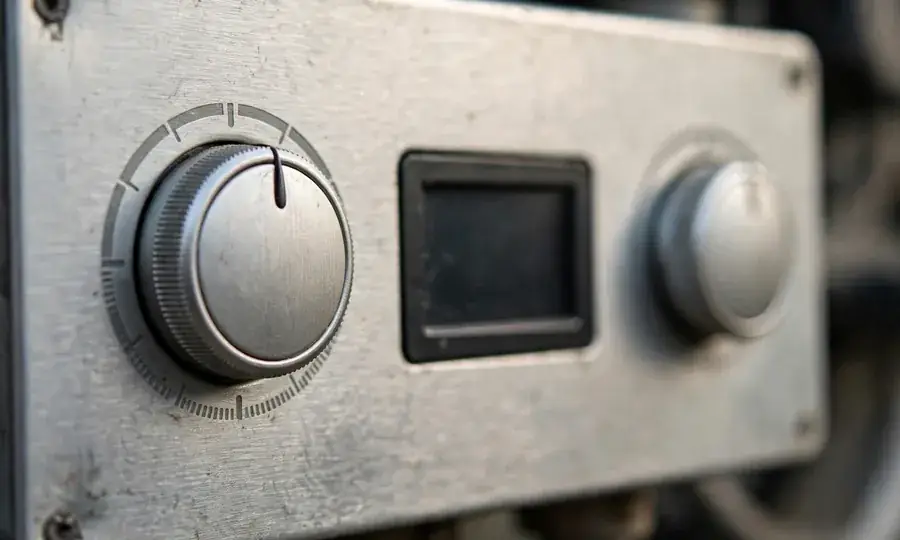 Close-up of boiler control knobs and display panel
