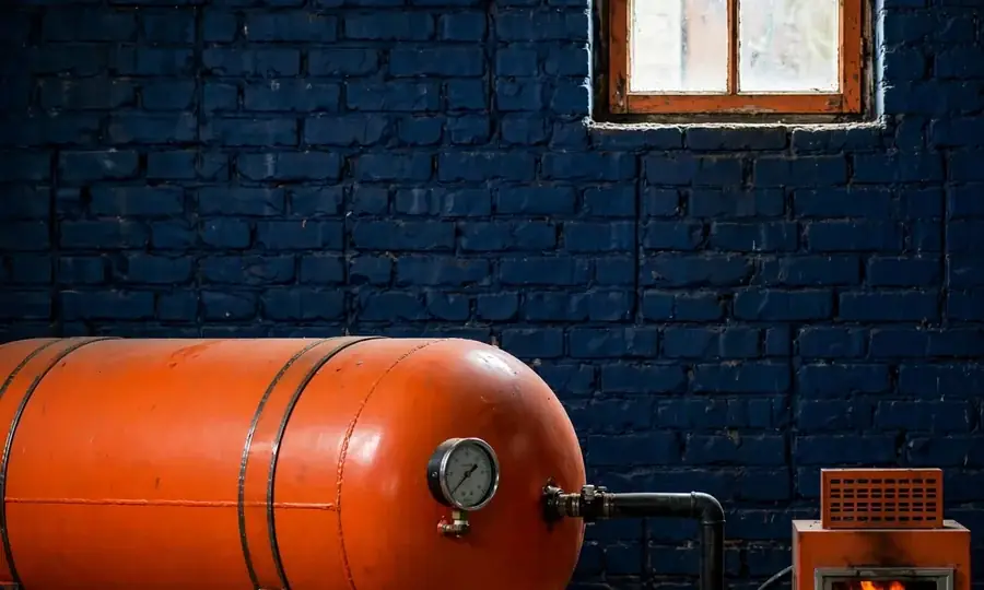 a home heating oil tank with fuel line to the burner